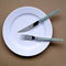 green bistro style fork and knife