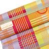 Colorful plaid fabric with a visible brand label on a white background