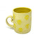 Yellow mug with skull designs on a white background