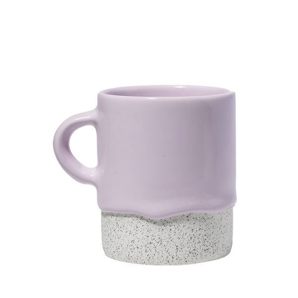 Pink ceramic mug with speckled clay base on a light gray background