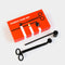 Candle care set with black tools and an orange box on a white background