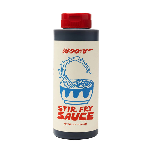 Bottle of Woon Stir Fry Sauce with red cap and label on a white background