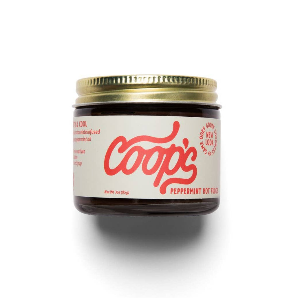 Jar of Coop's peppermint hot fudge on a white background