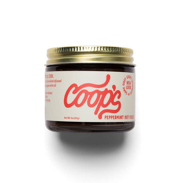 Jar of Coop's peppermint hot fudge on a white background