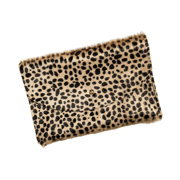 Leopard print clutch bag on a beige background