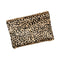Leopard print clutch bag on a beige background